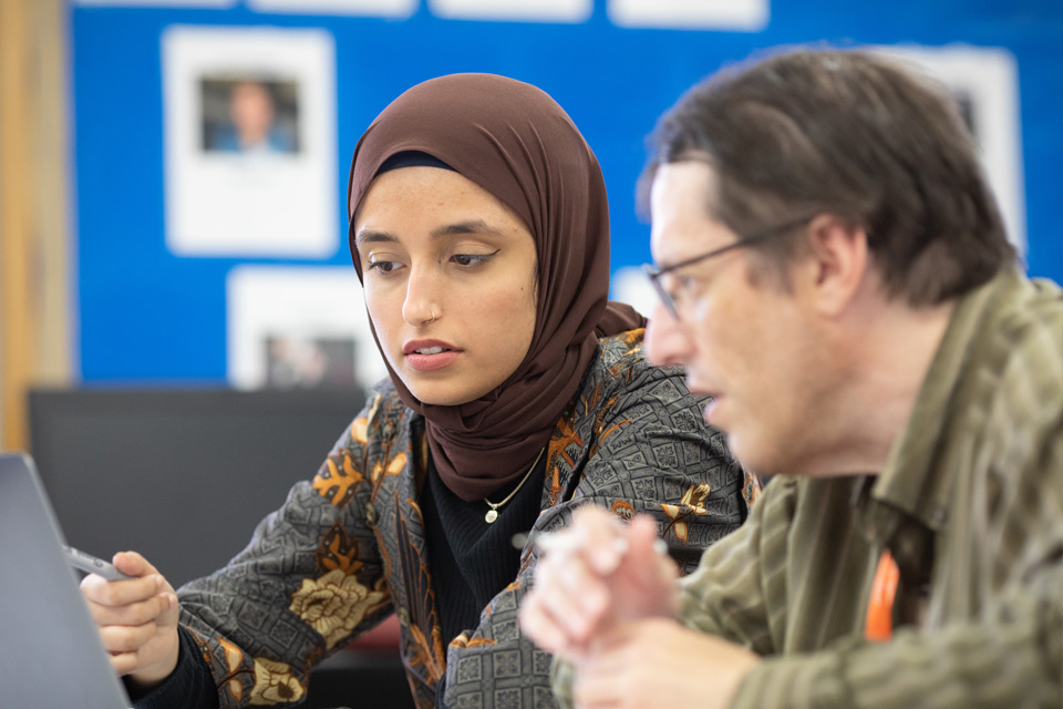 Female Muslim student being advised