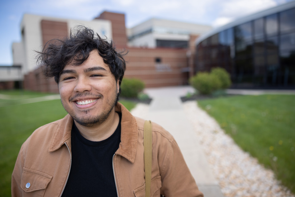 International male student standing outside