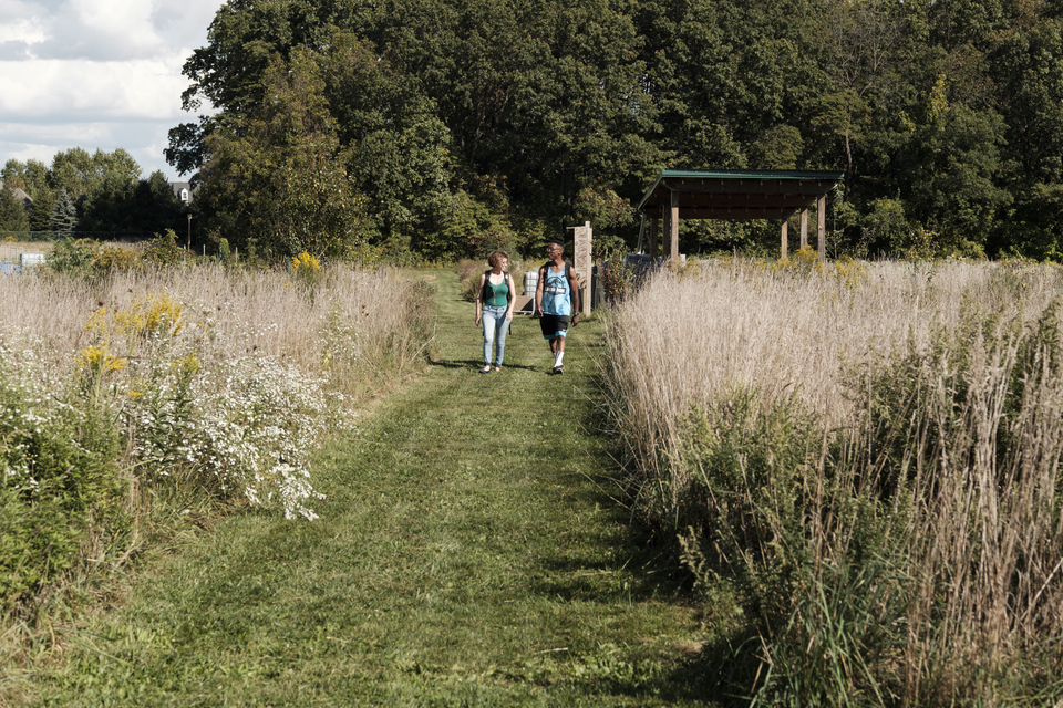 students walking through East 40 Garden