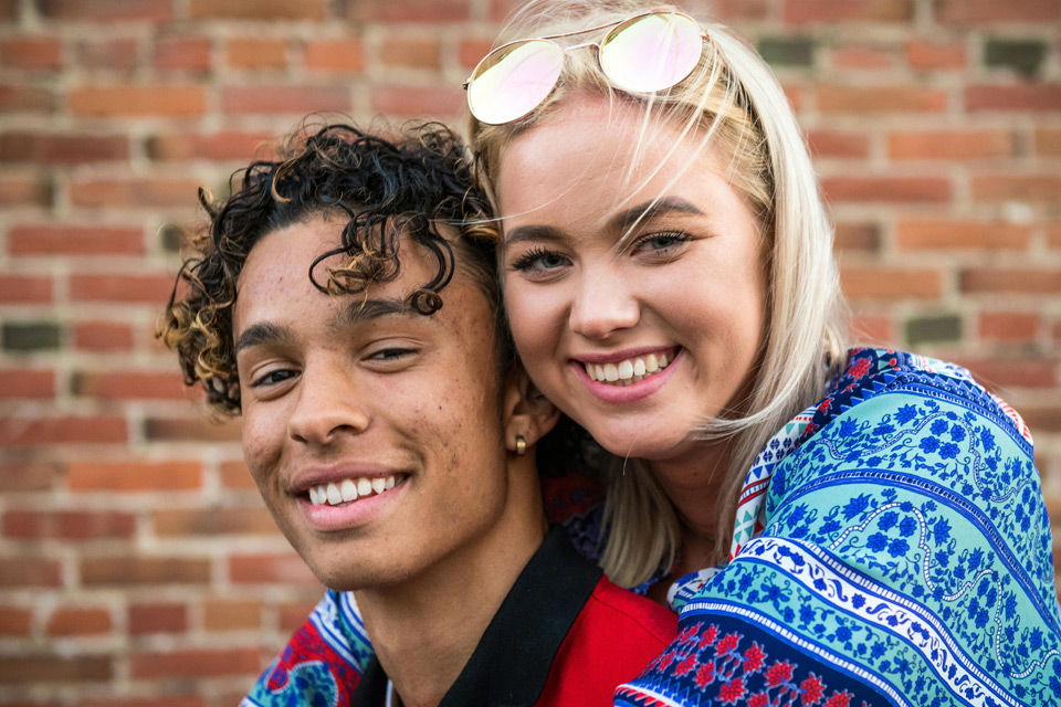 Young couple smiling at the camera