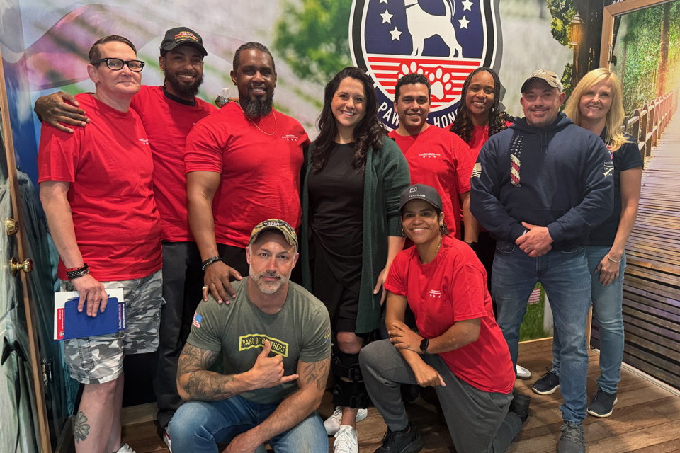 Diverse group of veterans posing for a picture