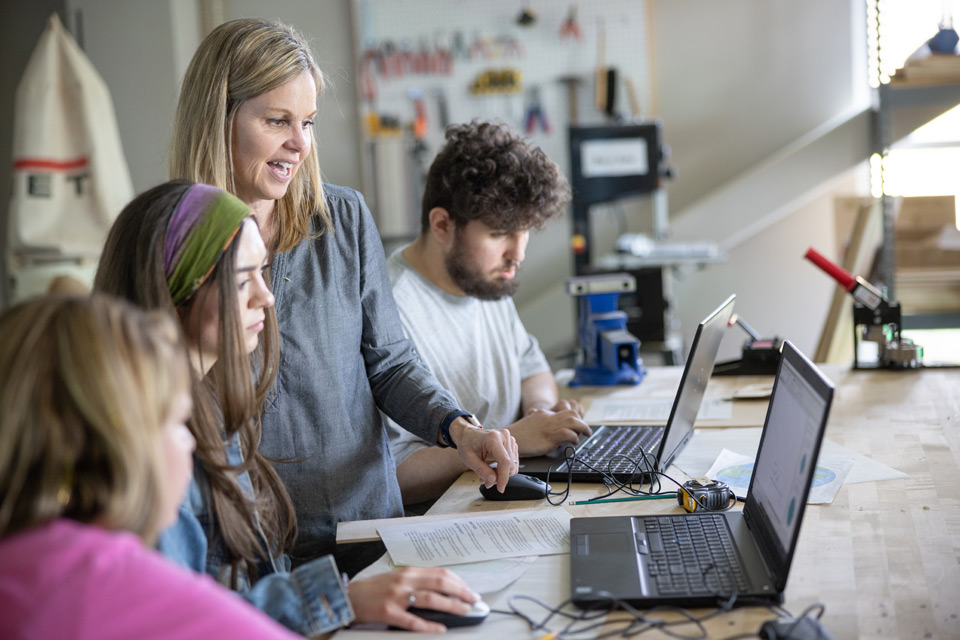 Professor assisting students
